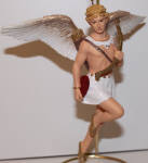 I'm glad I saw this one. He has a heart in his hand and a bow in the other...Cupid anyone??