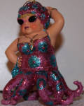 The colors were changed on her and made an interesting rare version of the well loved ornament. Only 3500 were made for Alzheimer's research. This one is a pretty rare item.  
