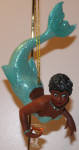 Another beautiful special mermaid in the collection. Choclatini dives like Miss Martini, but has a style all her own. Her face looks familiar to me. She reminds me of Lt. Uhura from Star Trek a little bit. She is one of the better mermaids in the collection. 