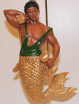 Biceps is another merman that was made twice using two different skin tones. The pale version with blonde hair, was Mr. Mussel. I liked these both enough because they had more differences than, say, Poseidon to Atlantis. Biceps' gold tail glitters beautifully under light in my curio. 
