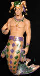 Cajun is revisiting of the Mardi Gras theme. Jambalaya was the first, Cajun is a follow up. He shows his face without a mask this time and holds the coin. Both he and Jambalaya are very unique ornaments and are very popular mermen in the collection. His mermaid counterpart is Beignet.