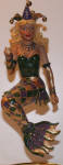 The female Cajun ornament. A Mardi Gras party mermaid. The female counterpart to Cajun and just as beautifully detailed in the marking/painting as her merman is. A must have!