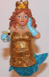 I think this one is kind of a joke along the lines of Muscle Beach, et al... I heard she was initially supposed to be a drag queen. I very much prefer personally the original Lemon Drop in the martini glass from '09 to this one. 
