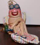 This guy is another early one. I especially love the lounging shrimp on his reclining beach blanket with drink in hand. He is another rare find 