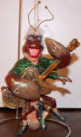 This guy is one of my very favorites of the older December Diamonds ornaments. How could they miss on this one?? Rock Lobster?? A lobster playing an electric guitar?? I love his white fuzzy hair! He is pretty rare by today's market. A great find! 