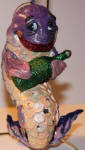 Ahhhh My favorite lush fish. Of course his name is Pickled Herring. A wino fish? a scream! lol... Great ornament