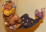 The original Poseidon ornament. They remade him into the gay themed merman in 2003. I think they were into making quirky merfish before the gay themed merman came along. These early ornaments had a lot of character to them but in more typical themes.The later ornaments are light yrars ahead of these.